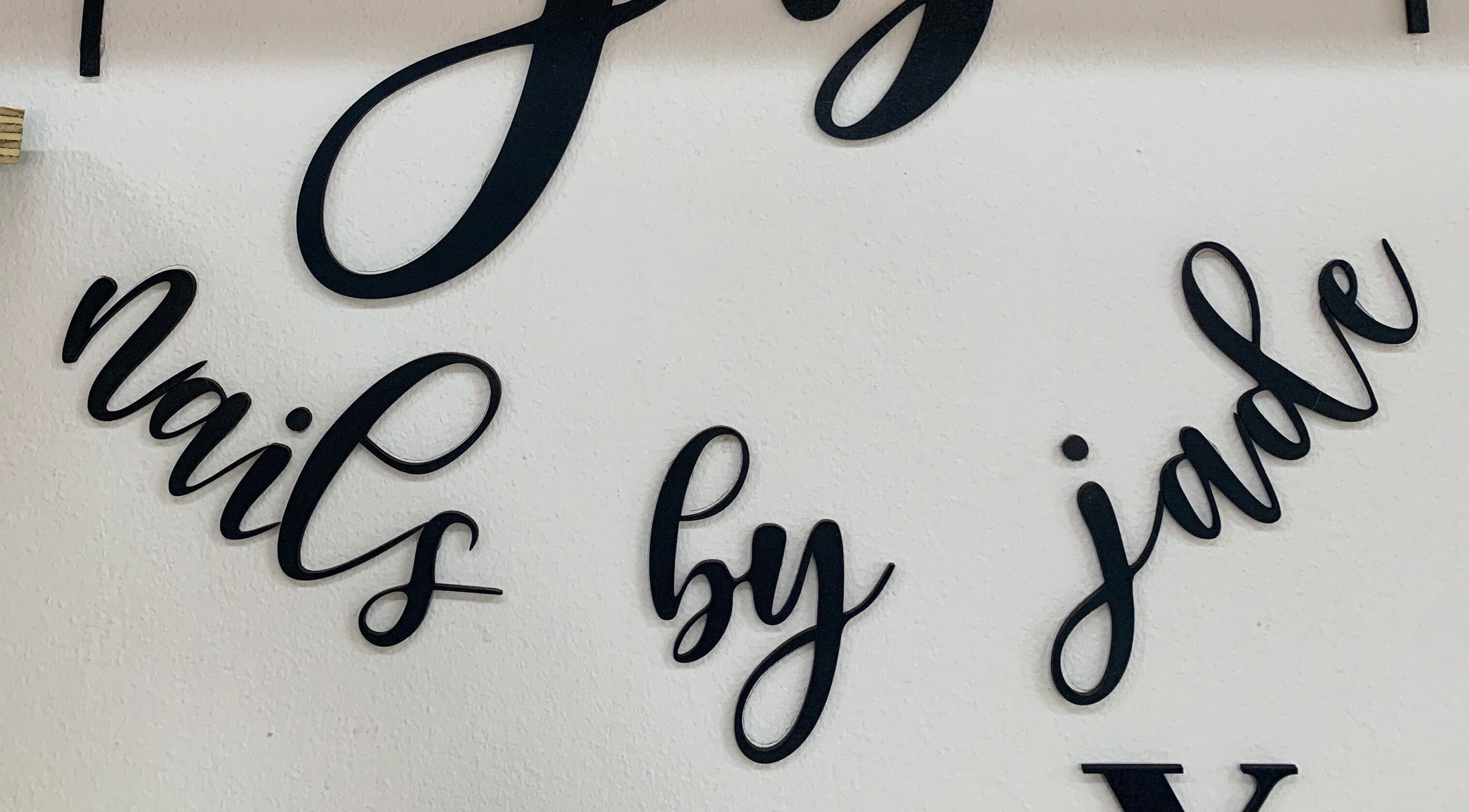 Elegant wall sign at Nails By Jade in Pietermaritzburg, Kwazulu-natal, ZA, showcasing artistic lettering.