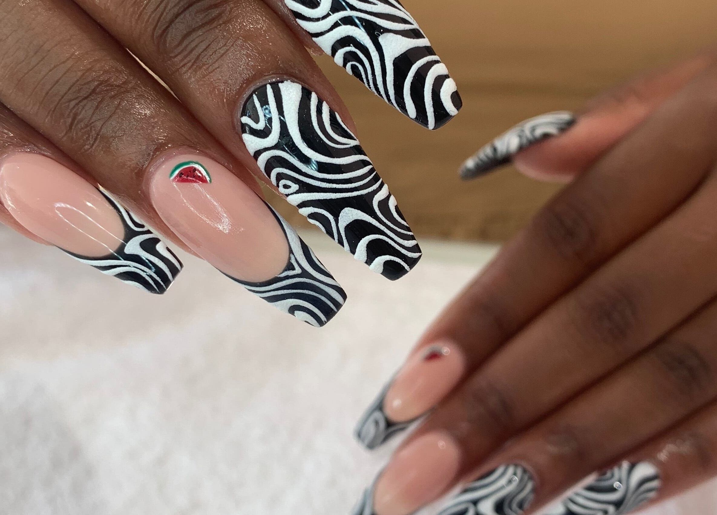 Stylish nail art at Nails By Jade, Pietermaritzburg, Kwazulu-natal, ZA. Intricate black swirl design on fingers.