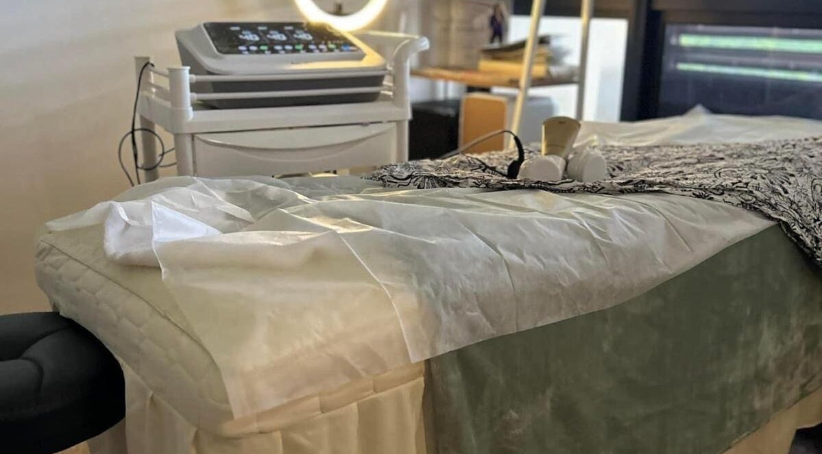 Luxurious treatment room at Pixiefacialspa, Singapore, SG with a plush bed and advanced beauty equipment.