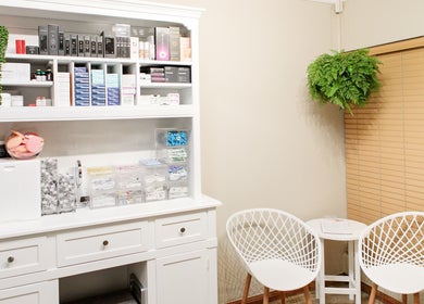 Sophisticated skincare display and seating at Dr. Jeanine Cronje Aesthetics in Pretoria, Gauteng, ZA.