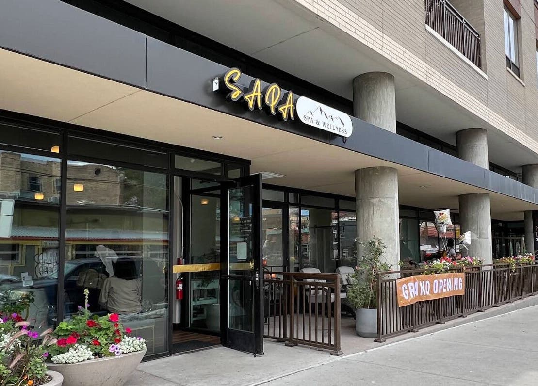 Street view of Sapa Spa and Wellness, Denver, Colorado, US, showcasing its modern exterior with floral decor.