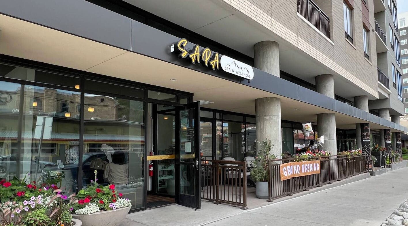 Street view of Sapa Spa and Wellness, Denver, Colorado, US, showcasing its modern exterior with floral decor.