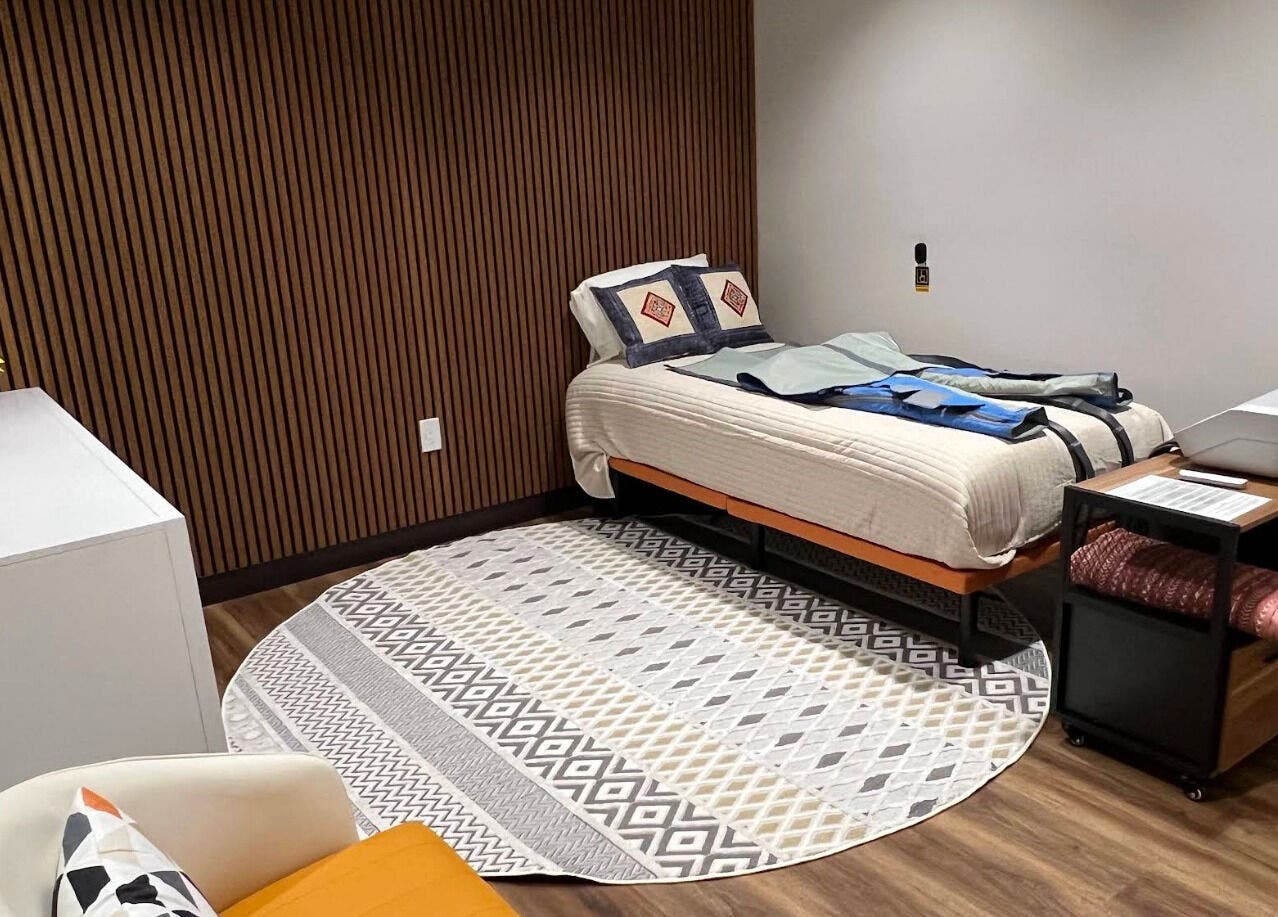 Relaxing therapy room at Sapa Spa and Wellness, Denver, Colorado, US, featuring a cozy bed and tranquil decor.