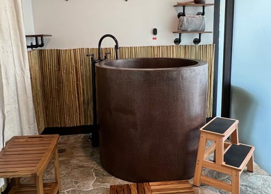 Relaxing bamboo-themed spa room with bath at Sapa Spa and Wellness, Denver, Colorado, US.