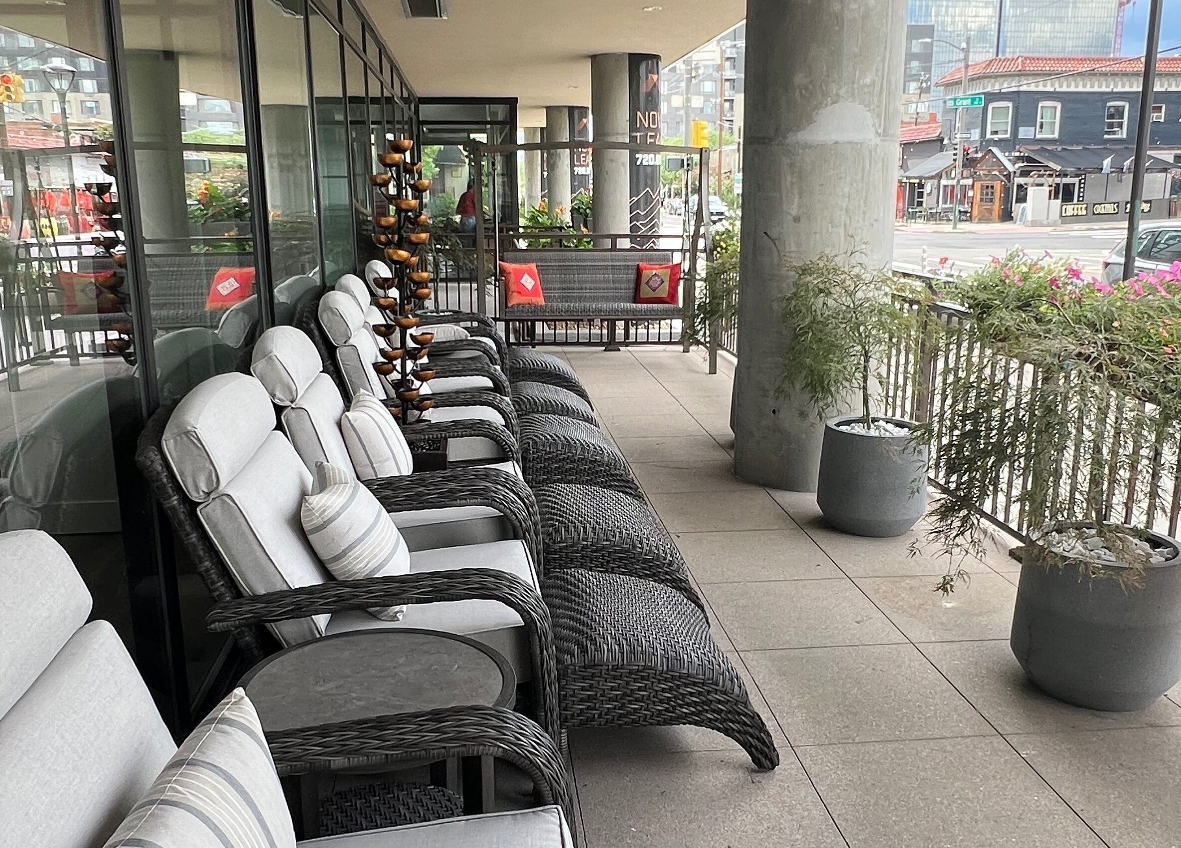 Comfortable outdoor seating at Sapa Spa and Wellness, Denver, Colorado, US overlooking the vibrant city streets.
