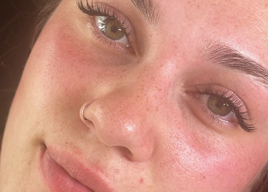 Close-up of a woman's radiant face after treatment at The Beauty Shed, Blunsdon Saint Andrew, England, GB.