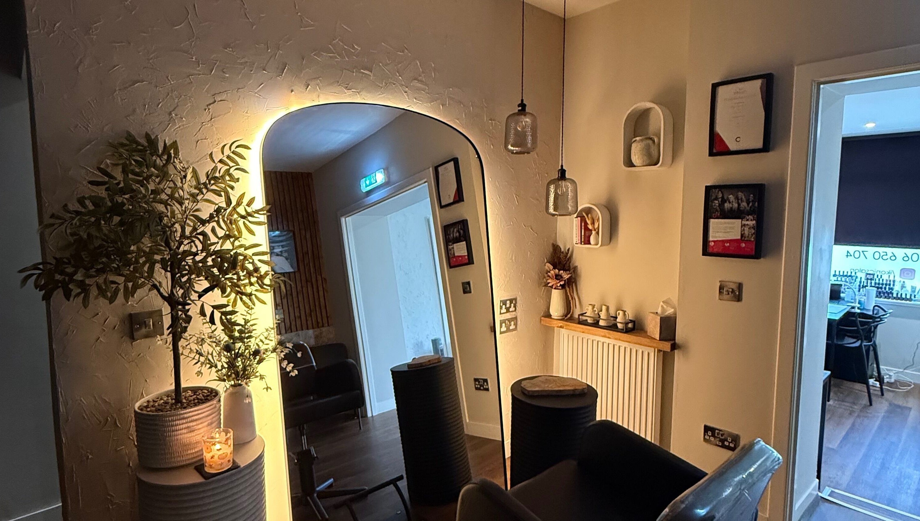 Inviting décor at Megan Sutherland Hair in Bathgate, Scotland, GB with ambient lighting and stylish furnishing.