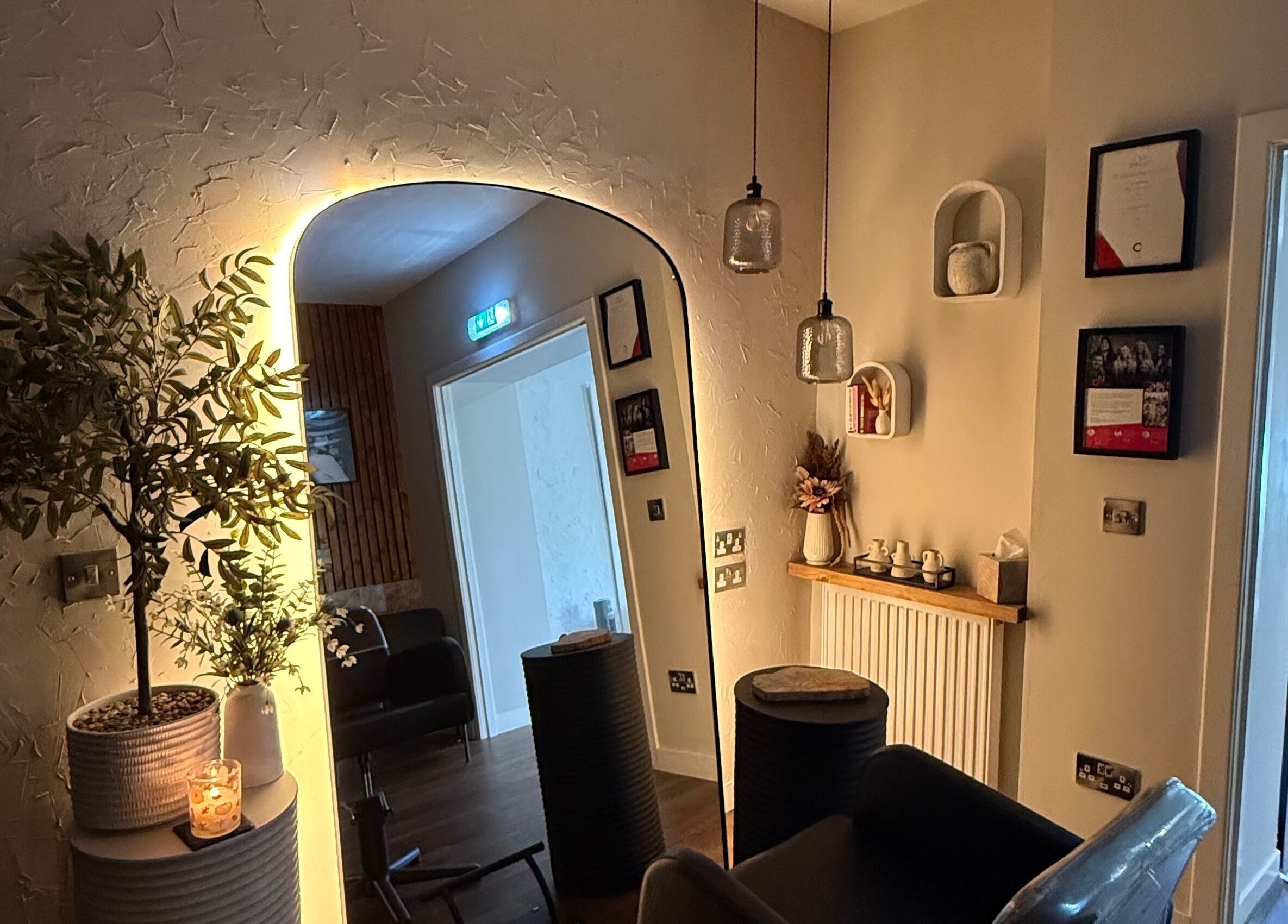 Inviting décor at Megan Sutherland Hair in Bathgate, Scotland, GB with ambient lighting and stylish furnishing.