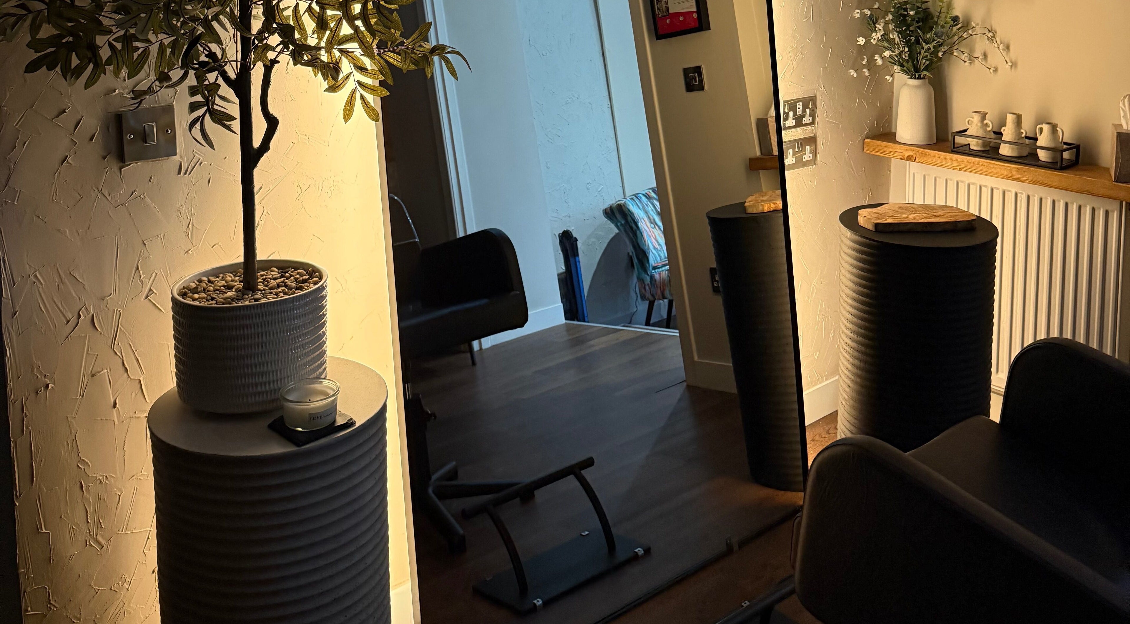 Elegant interior of Megan Sutherland Hair, Bathgate, Scotland, featuring stylish chairs and decor.