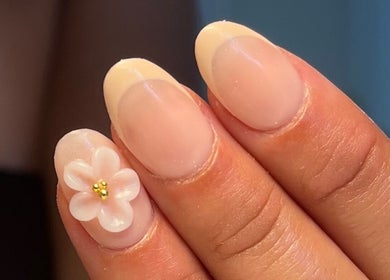 Elegant flower nail art by Nails by Kara May in Bridport, England, GB, showcasing delicate craftsmanship.