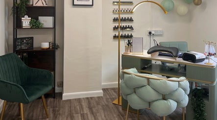 Elegant nail salon setup at Nails by Kara May, Bridport, England, GB. Cozy decor with plush seating and manicure station.