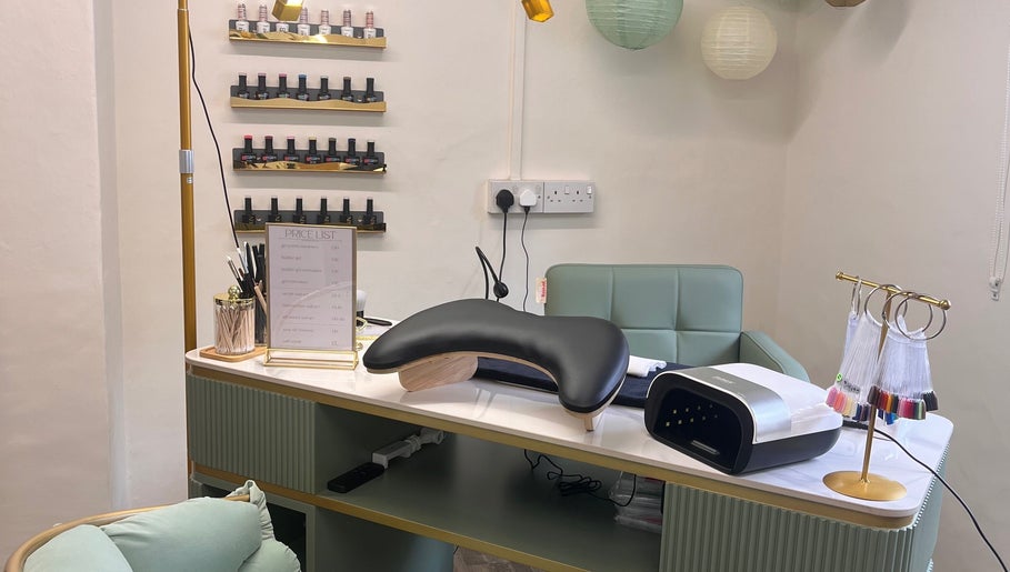 Sophisticated manicure station at Nails by Kara May in Bridport, England, GB, showcasing nail polishes and equipment.