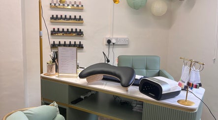 Sophisticated manicure station at Nails by Kara May in Bridport, England, GB, showcasing nail polishes and equipment.
