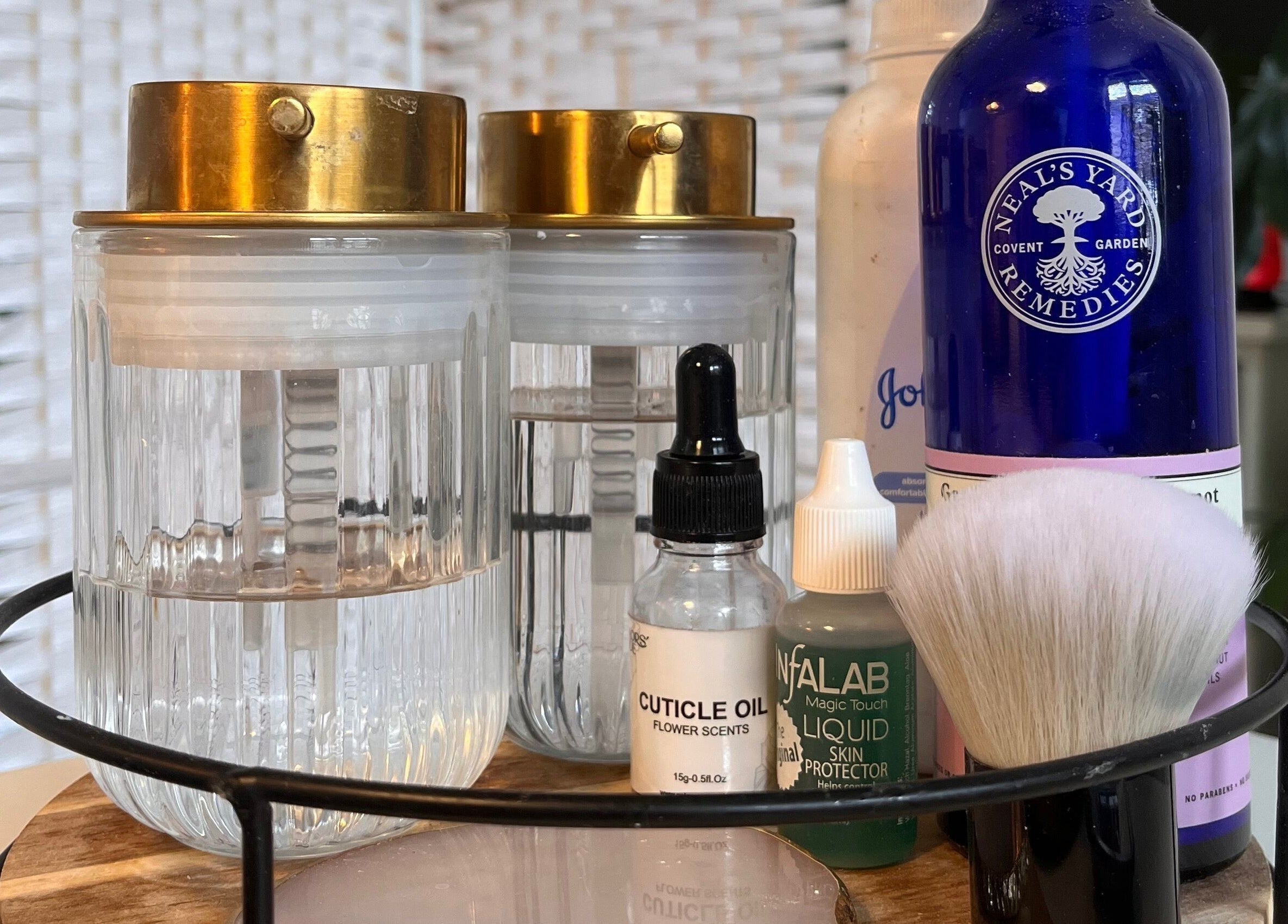 Beauty products at Nails by Kara May, Bridport, England, GB showcasing oils and brushes for a perfect manicure.