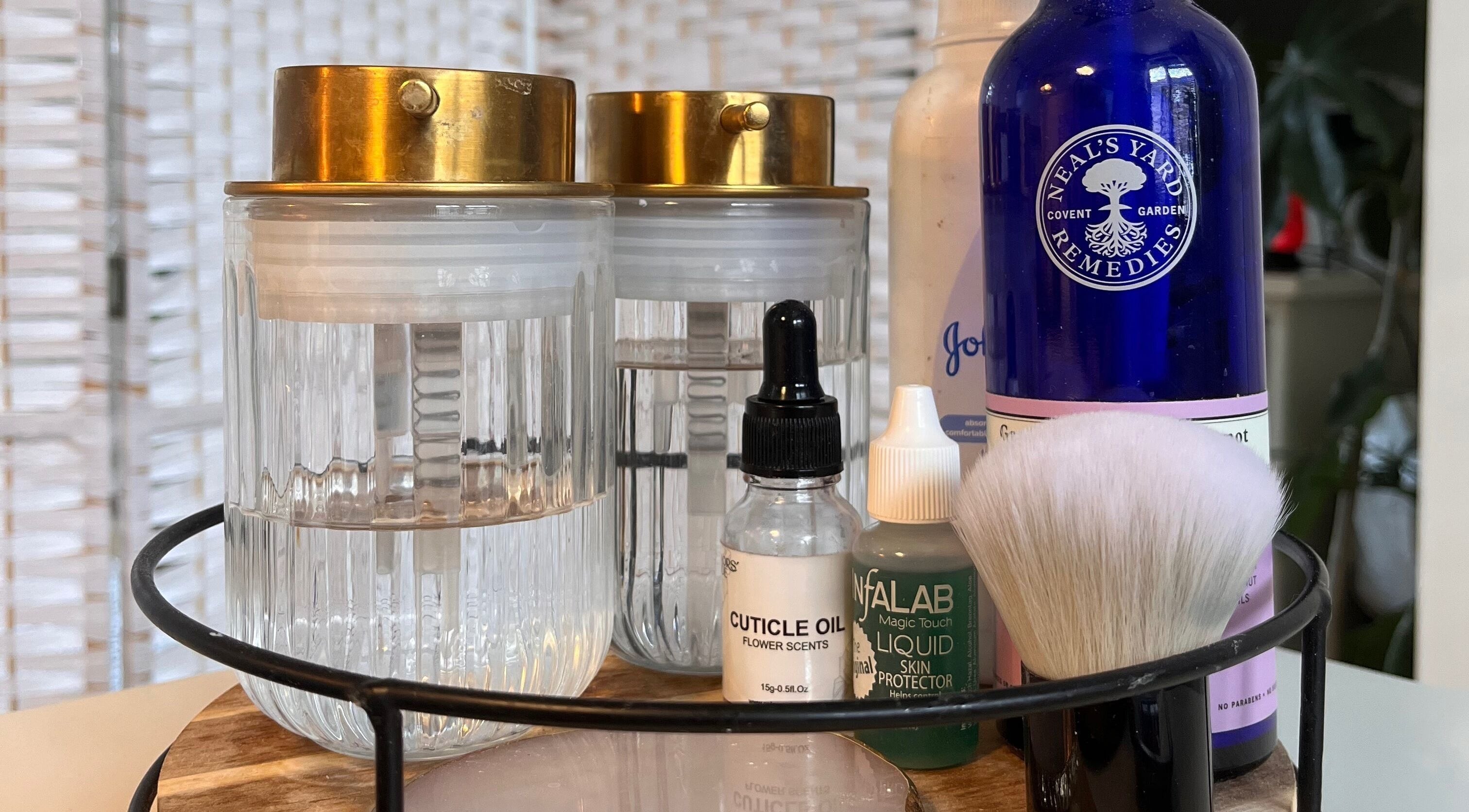 Beauty products at Nails by Kara May, Bridport, England, GB showcasing oils and brushes for a perfect manicure.