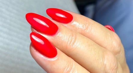 Vibrant red manicure at Polished by Jasmin, Worcester, England, GB, showcasing elegant nail art.