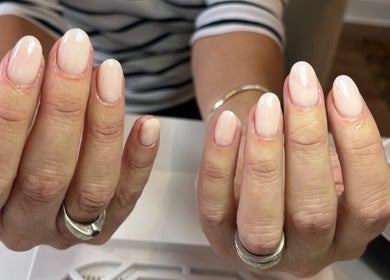 Fresh manicure at Polished by Jasmin, Worcester, England, GB showcasing glossy pink nails.