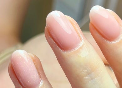 Close-up of glossy pink manicure at Polished by Jasmin, Worcester, England, GB.