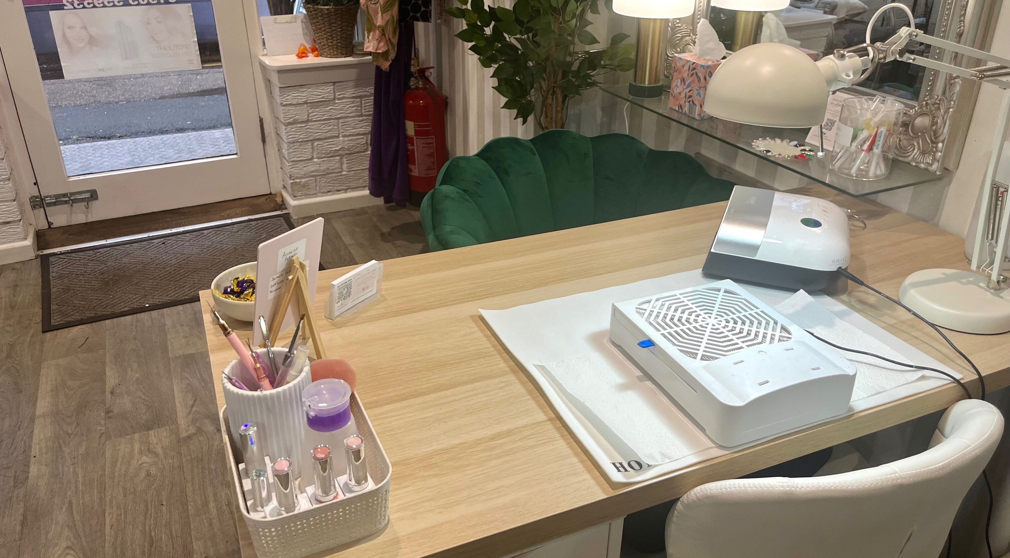 Nail station at Polished by Jasmin, Worcester, England, GB, featuring modern tools and decor.