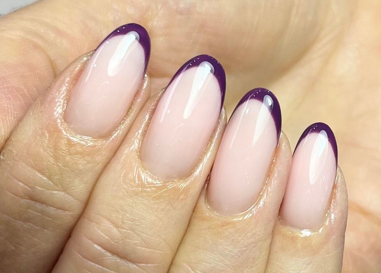 Stylish purple-tipped manicure at Polished by Jasmin, Worcester, England, GB, showcasing nail artistry.