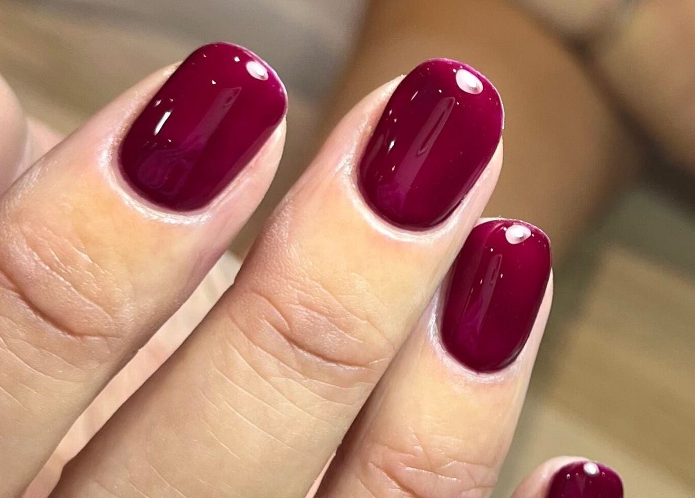 Crimson gel nails at Polished by Jasmin, Worcester, England, GB, showcasing expert manicure skills.