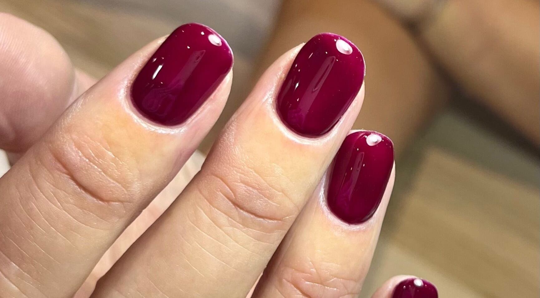 Crimson gel nails at Polished by Jasmin, Worcester, England, GB, showcasing expert manicure skills.