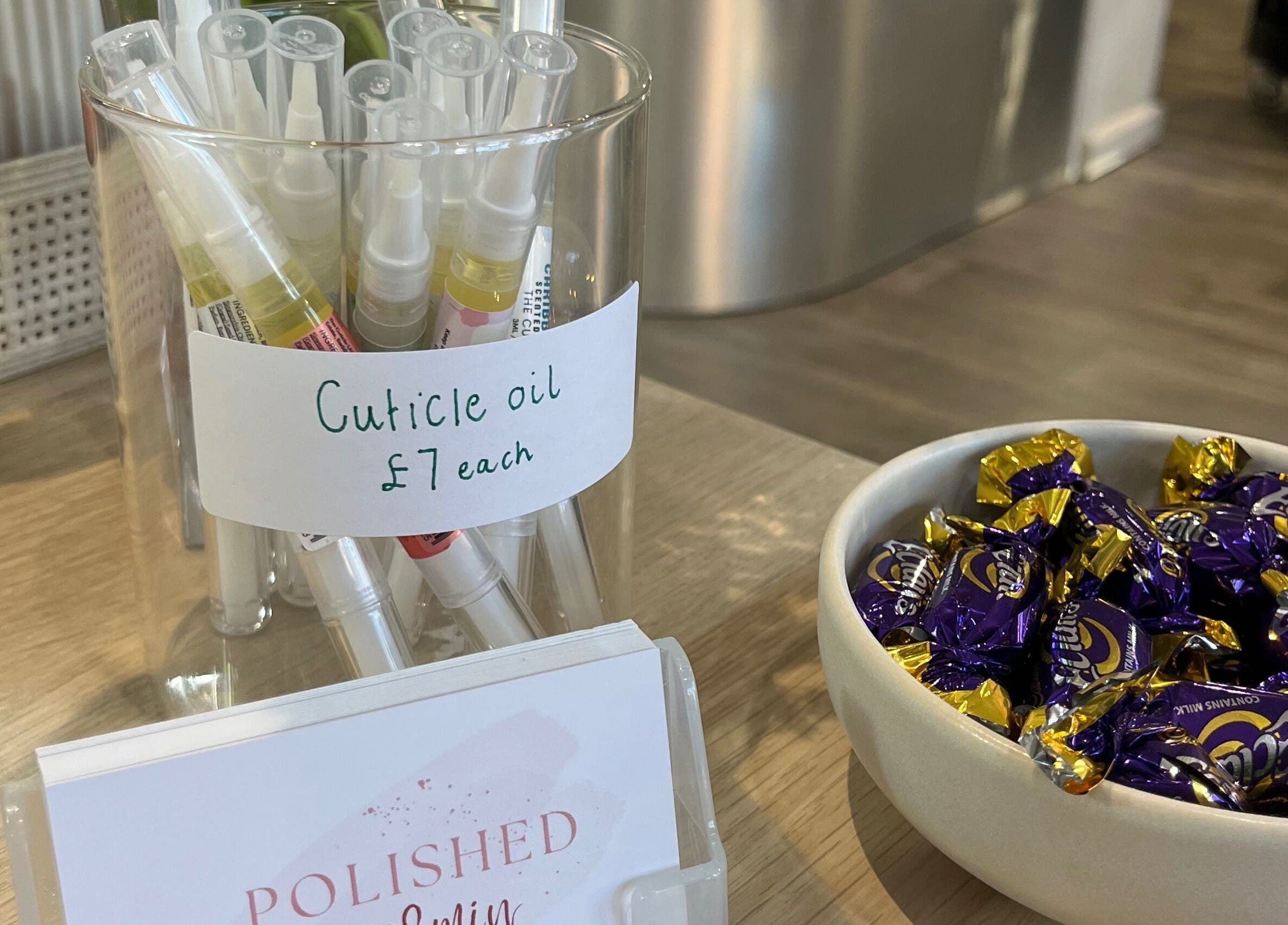 Cuticle oil on display with candy at Polished by Jasmin, Worcester, England, GB.