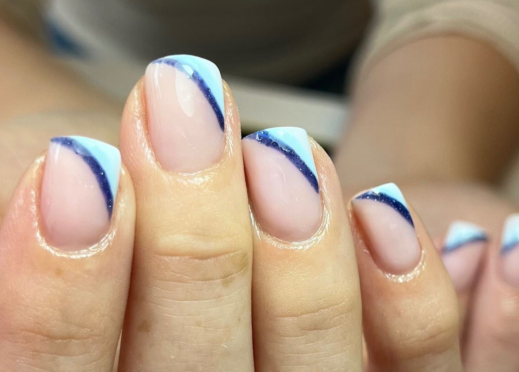 Blue and white nail art at Polished by Jasmin, Worcester, England, GB.