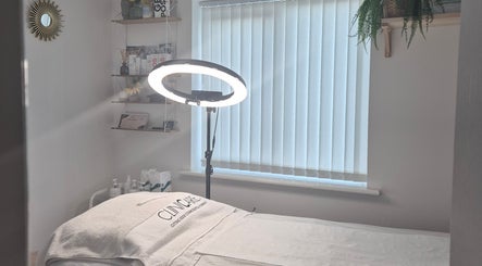 Therapy room at Julia Plas Skin Alsager, Stoke-on-Trent, England, featuring treatment bed and ambient lighting.
