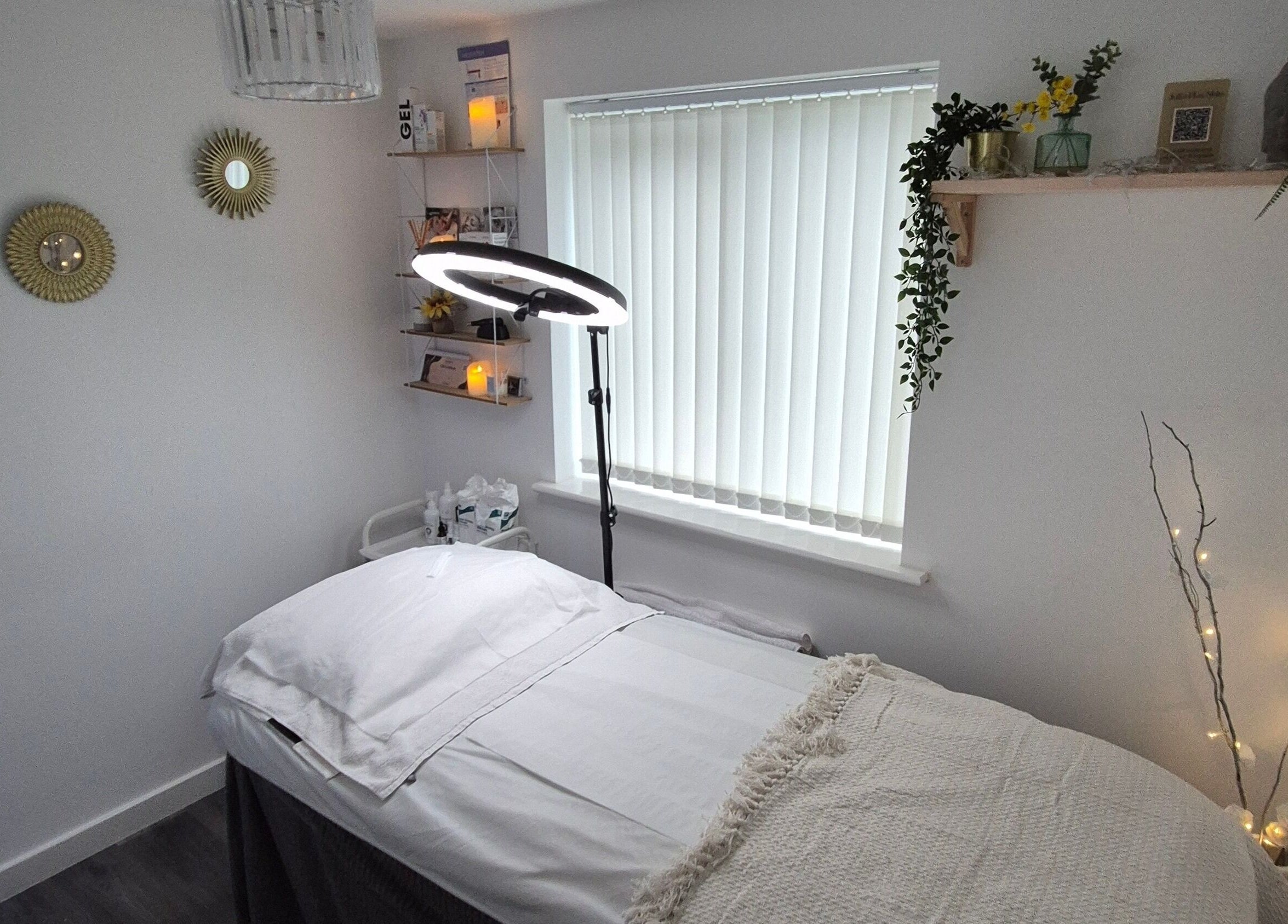 Serene treatment room at Julia Plas Skin Alsager, Stoke-on-Trent, England, GB with soft lighting and decor.