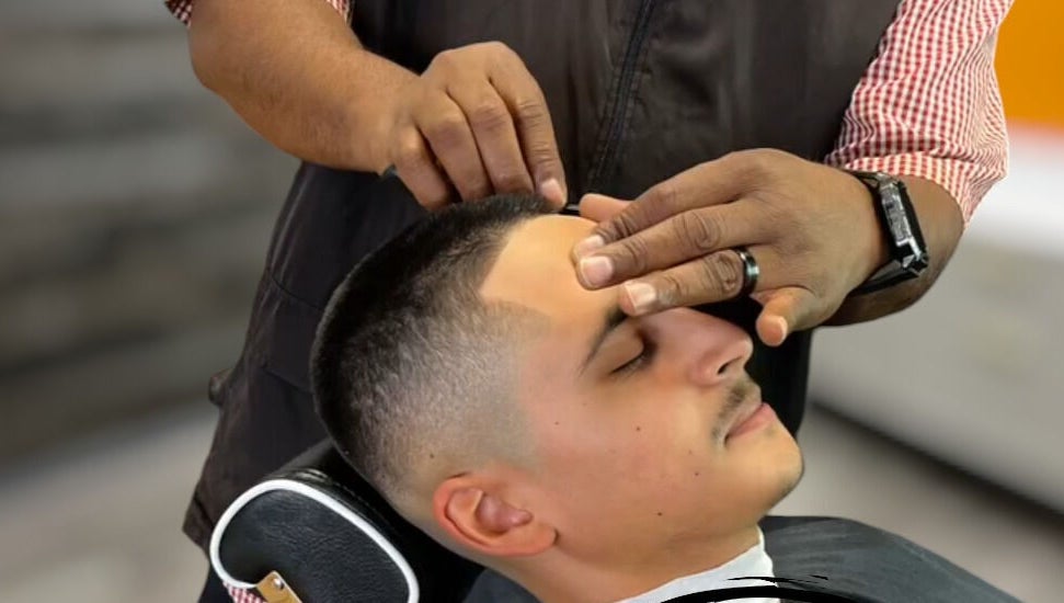Close-up of grooming service at The Introvert Men's Grooming Lounge, Chandler, Arizona, US enhancing customer relaxation.