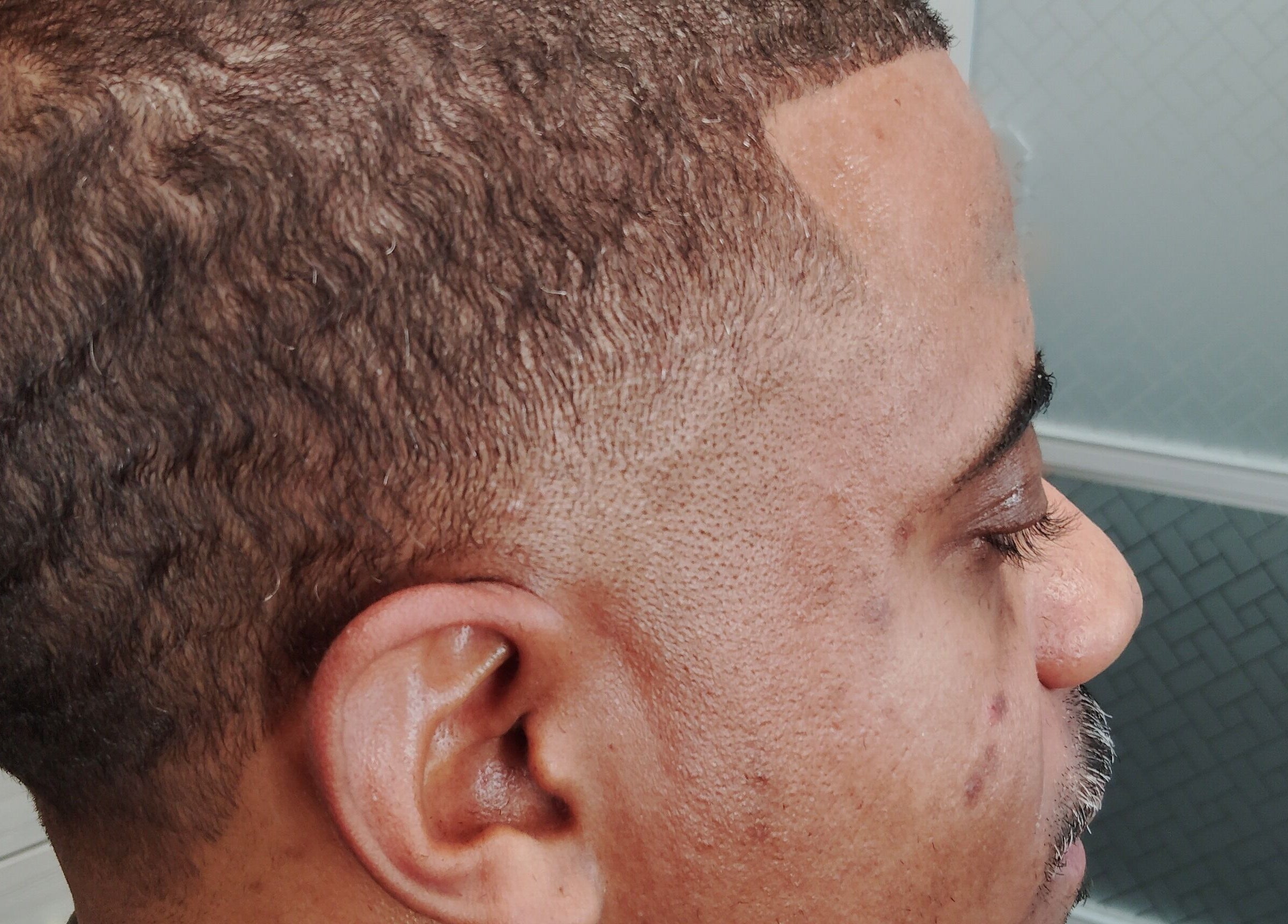 Close-up of a stylish fade haircut at The Introvert Men's Grooming Lounge in Chandler, Arizona, US.