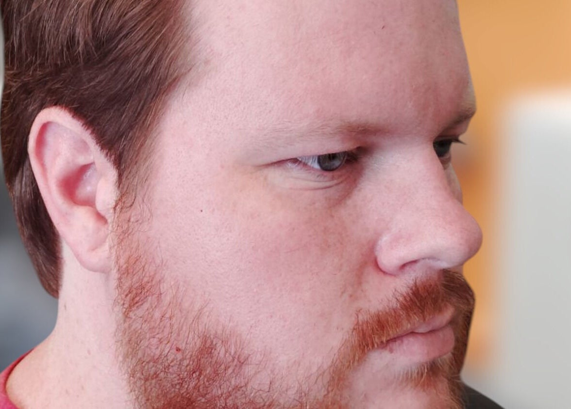 Side profile of a well-groomed man at The Introvert Men's Grooming Lounge, Chandler, Arizona, US.