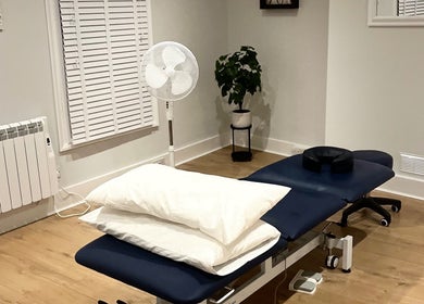 Therapy room at Renew Massage and Wellness Uckfield, featuring a massage table and decor in Uckfield, England, GB.