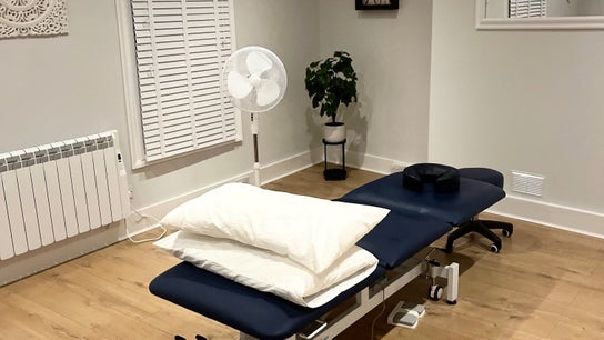 Therapy room at Renew Massage and Wellness Uckfield, featuring a massage table and decor in Uckfield, England, GB.