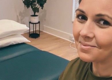Therapist in serene massage room at Renew Massage and Wellness Uckfield, Uckfield, England, GB.
