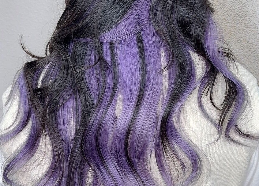 Long wavy hair with lavender highlights at Art OS Hair Salon, San Gabriel, California, US.