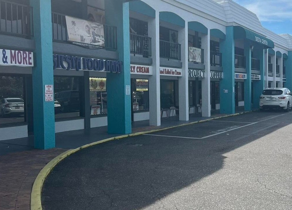 Exterior view of ZY Massage Spa in Sarasota, Florida, US showcasing the modern facade with ample parking.