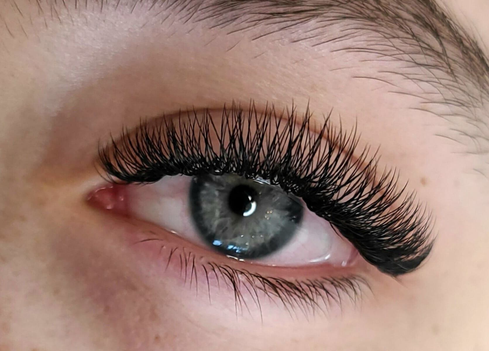 Close-up of lash extensions by Nettb Beauty, Winnipeg, Manitoba, CA, showcasing elegant eye enhancement.
