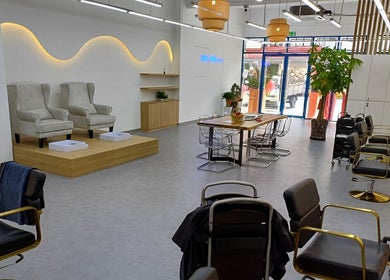 Elegant interior of Serahair By Seoul Korea Salon in Johor Bahru, Johor, MY featuring modern chairs.