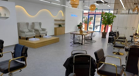 Elegant interior of Serahair By Seoul Korea Salon in Johor Bahru, Johor, MY featuring modern chairs.