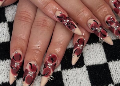 Intricate red and black nail art with silver accents at Savage Skin and Beauty, Stockton-on-tees, England, GB.
