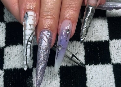 Elegant stiletto nails with silver and purple design at Savage Skin and Beauty, Stockton-on-tees, England, GB.