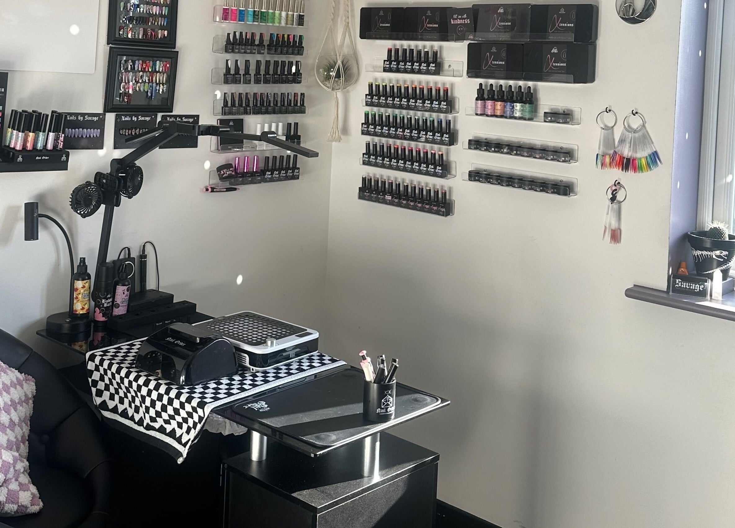 Nail salon interior at Savage Skin and Beauty in Stockton-on-Tees, England showcasing polish displays.