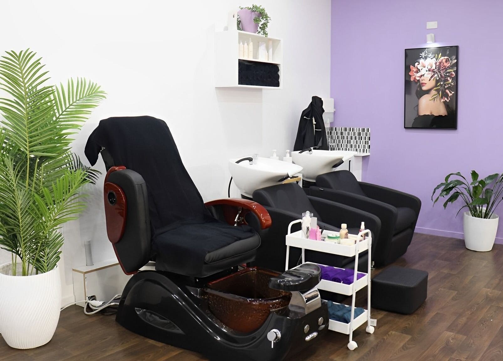 Comfortable salon interior at Glam Plus Hair & Beauty Salon, Auckland, Auckland, NZ with chairs and plant decor.