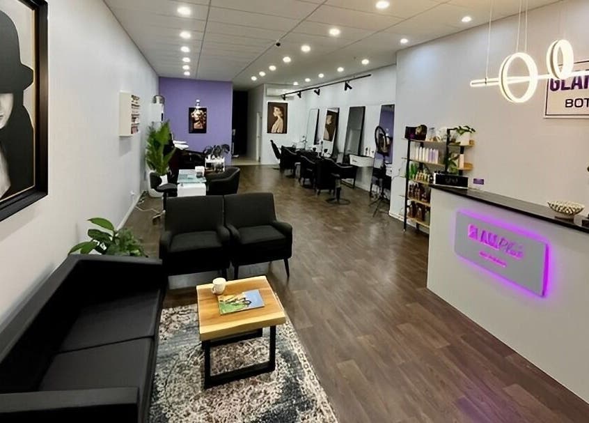 Stylish interior of Glam Plus Hair & Beauty Salon in Auckland, NZ with modern decor and sleek furnishings.