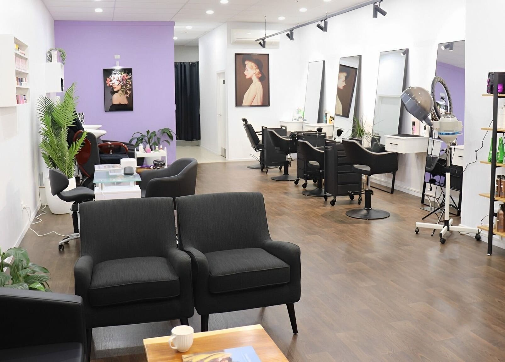 Modern interior of Glam Plus Hair & Beauty Salon in Auckland, Auckland, NZ with stylish seating and workstations.