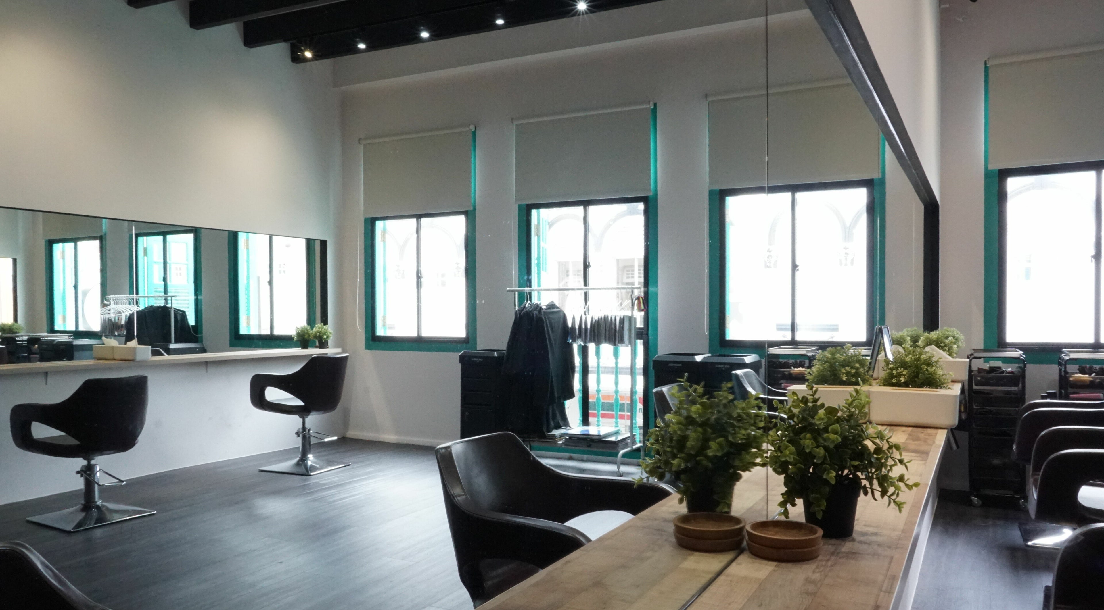 Chic interior of Salon Nu with stylish chairs and lush plants in Singapore, Singapore, SG.