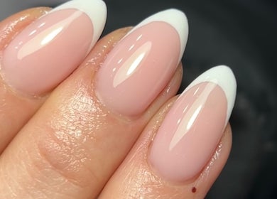 French tip nails at Nails by Aims Xo, Bolsover, England, GB, showcasing glossy finish and elegance.