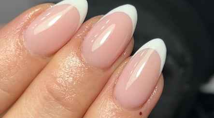 French tip nails at Nails by Aims Xo, Bolsover, England, GB, showcasing glossy finish and elegance.